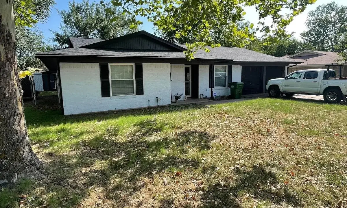 Professional roofing crew working on a residential roof in Glenmont
